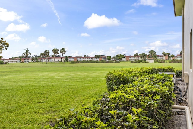 8 Vista Palm Ln Unit 103, Vero Beach, FL 32962 - view of green lawn with a residential view