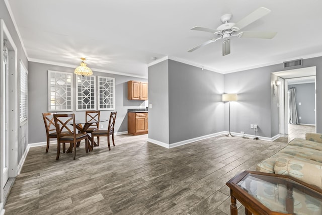 8 Vista Palm Ln Unit 103, Vero Beach, FL 32962 - dining space with crown molding, wood finished floors, baseboards, and a ceiling fan