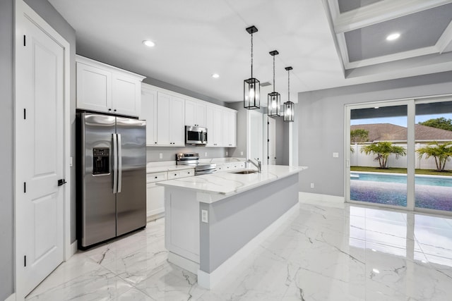2265 SW Kenwick Ave, Port Saint Lucie, FL 34953 - kitchen with stainless steel appliances, recessed lighting, light marble finish flooring, light stone countertops, and white cabinetry