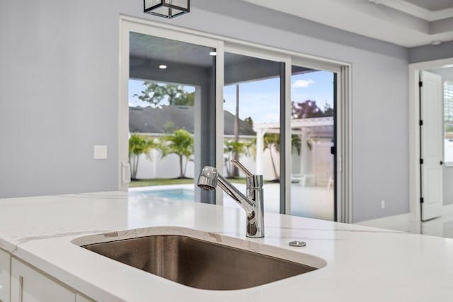 2265 SW Kenwick Ave, Port Saint Lucie, FL 34953 - kitchen with healthy amount of natural light and light stone countertops
