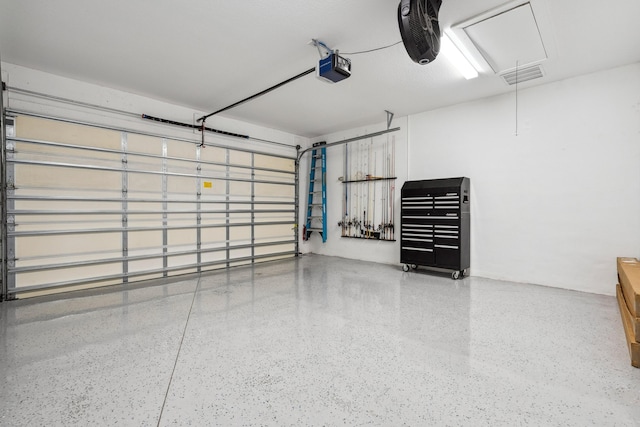 2265 SW Kenwick Ave, Port Saint Lucie, FL 34953 - garage featuring a garage door opener