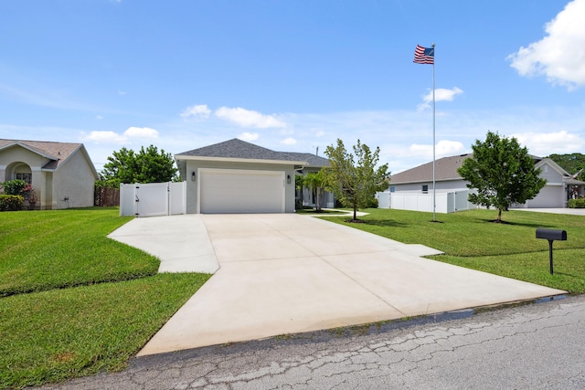 2265 SW Kenwick Ave, Port Saint Lucie, FL 34953 - single story home featuring driveway, an attached garage, a gate, and stucco siding