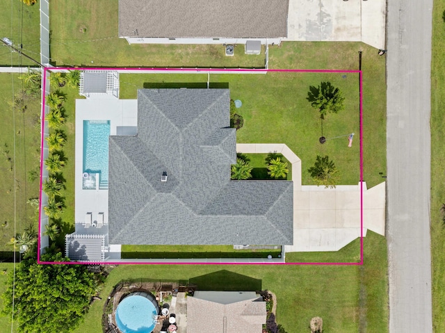 2265 SW Kenwick Ave, Port Saint Lucie, FL 34953 - aerial view of property and surrounding area featuring a pool and property parcel outlined