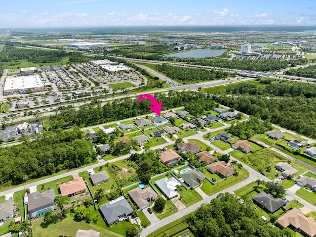 2265 SW Kenwick Ave, Port Saint Lucie, FL 34953 - aerial view of property's location with nearby suburban area and a large body of water