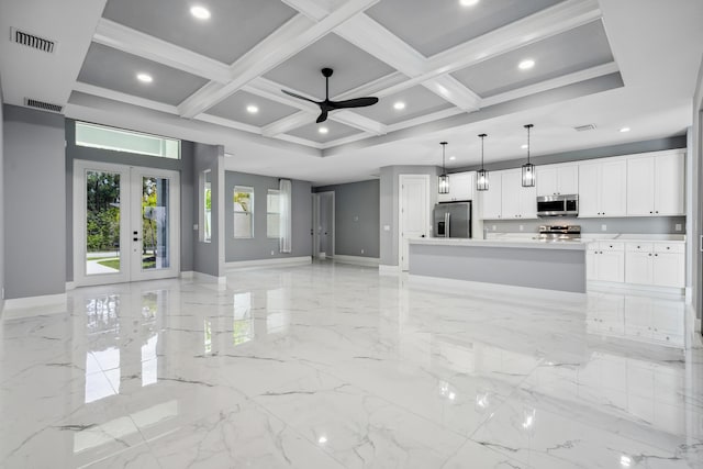 2265 SW Kenwick Ave, Port Saint Lucie, FL 34953 - unfurnished living room featuring a ceiling fan, light marble finish floors, french doors, beam ceiling, and recessed lighting