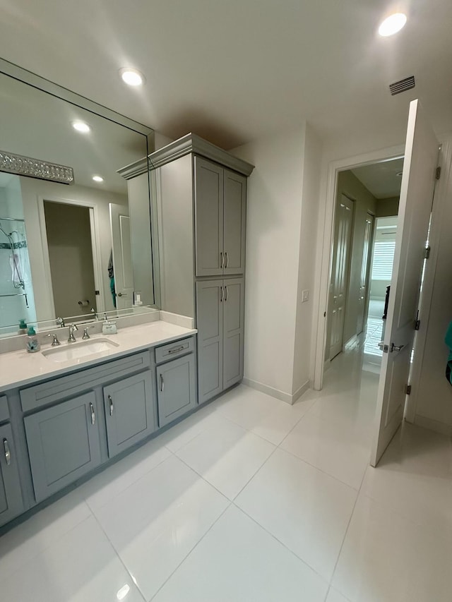 10876 SW Sunray St, Port Saint Lucie, FL 34987 - bathroom featuring vanity, tile patterned flooring, recessed lighting, and baseboards