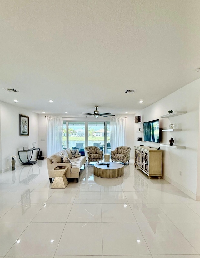 10876 SW Sunray St, Port Saint Lucie, FL 34987 - living room featuring a ceiling fan and recessed lighting
