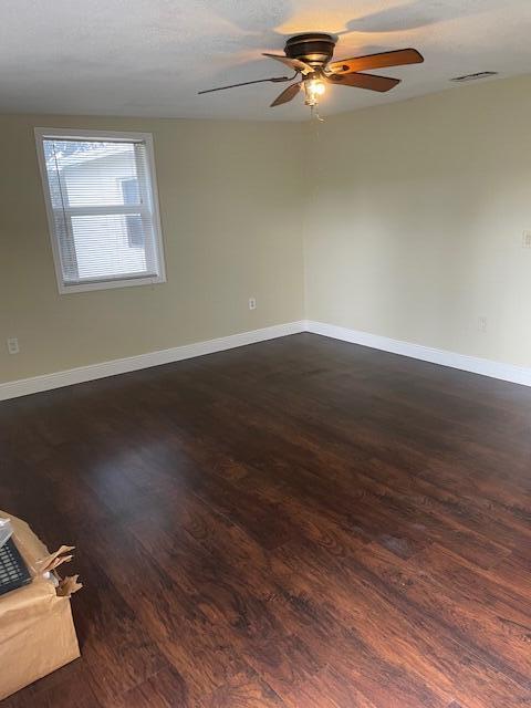 405 SW 77th Ave, North Lauderdale, FL 33068 - spare room featuring dark wood finished floors, ceiling fan, and baseboards