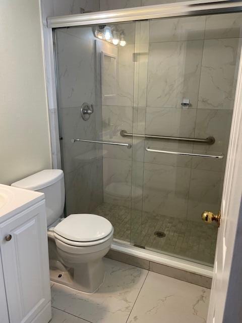 405 SW 77th Ave, North Lauderdale, FL 33068 - full bath featuring marble finish floors, toilet, vanity, and a stall shower