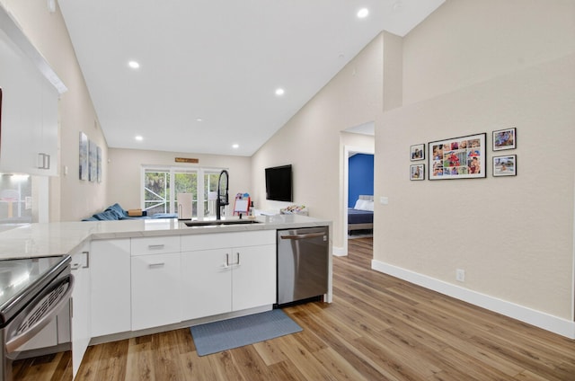 11080 Lakeaire Cir, Boca Raton, FL 33498 - kitchen with dishwasher, a sink, open floor plan, electric range, and light wood-style floors