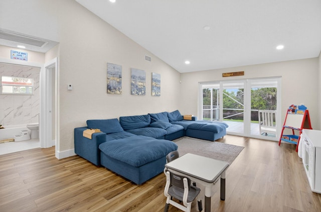 11080 Lakeaire Cir, Boca Raton, FL 33498 - living room with vaulted ceiling, light wood-style flooring, and recessed lighting