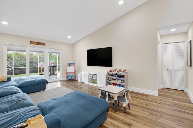 11080 Lakeaire Cir, Boca Raton, FL 33498 - living area featuring lofted ceiling, baseboards, light wood finished floors, and recessed lighting