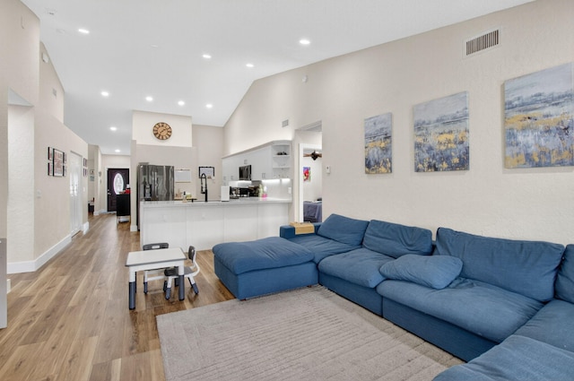 11080 Lakeaire Cir, Boca Raton, FL 33498 - living room with light wood-style floors, high vaulted ceiling, recessed lighting, and baseboards