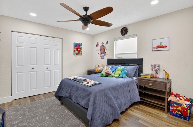 11080 Lakeaire Cir, Boca Raton, FL 33498 - bedroom featuring wood finished floors, a closet, ceiling fan, and recessed lighting