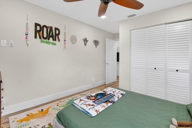 11080 Lakeaire Cir, Boca Raton, FL 33498 - bedroom featuring light wood-style floors, baseboards, a closet, and a ceiling fan