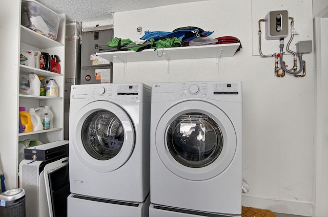 11080 Lakeaire Cir, Boca Raton, FL 33498 - washroom with separate washer and dryer and a textured ceiling
