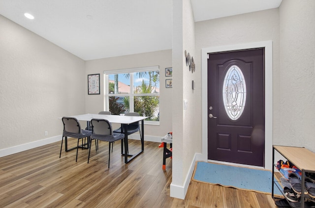 11080 Lakeaire Cir, Boca Raton, FL 33498 - foyer with baseboards, a textured wall, and wood finished floors