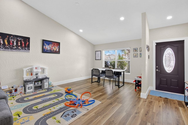 11080 Lakeaire Cir, Boca Raton, FL 33498 - entryway with wood finished floors, lofted ceiling, recessed lighting, and baseboards