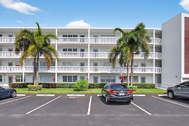 1116 Cambridge E Unit E, Deerfield Beach, FL 33442 - view of apartment building / complex with uncovered parking