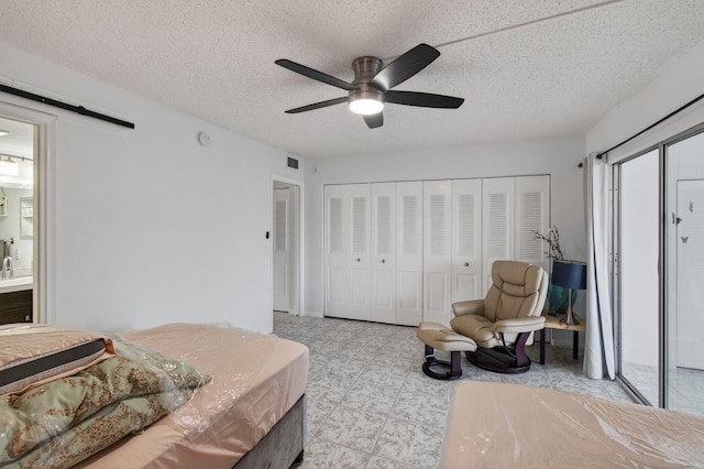 1116 Cambridge E Unit E, Deerfield Beach, FL 33442 - bedroom with ceiling fan and a textured ceiling