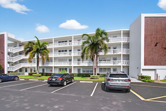 1116 Cambridge E Unit E, Deerfield Beach, FL 33442 - view of apartment building / complex with uncovered parking