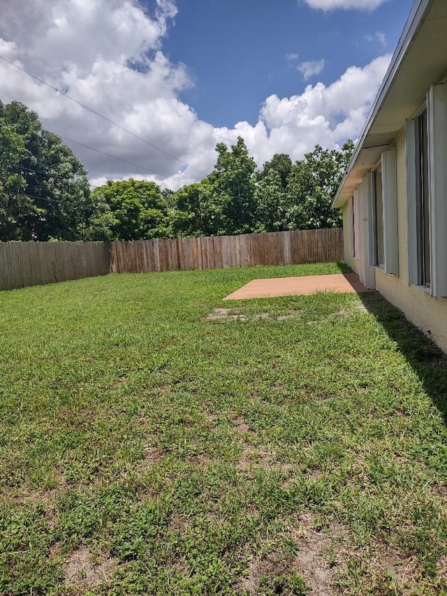 1032 SW Castaneda Ln SW, Port Saint Lucie, FL 34953 - fenced backyard featuring a patio