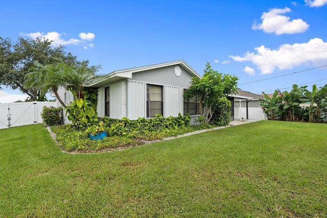 2455 SW Datura Ave, Port Saint Lucie, FL 34953 - view of property exterior with a gate
