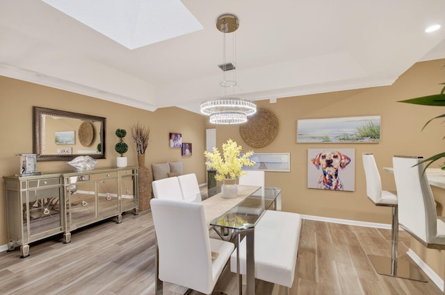 12562 Crystal Pointe Dr Unit B, Boynton Beach, FL 33437 - dining area featuring a chandelier, wood finished floors, baseboards, a tray ceiling, and recessed lighting