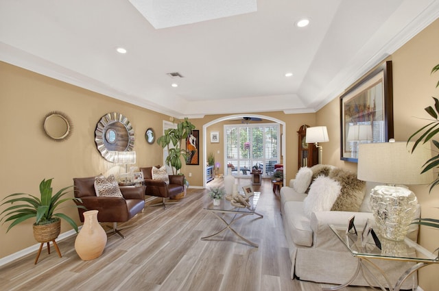 12562 Crystal Pointe Dr Unit B, Boynton Beach, FL 33437 - living area with arched walkways, light wood-type flooring, baseboards, recessed lighting, and a raised ceiling