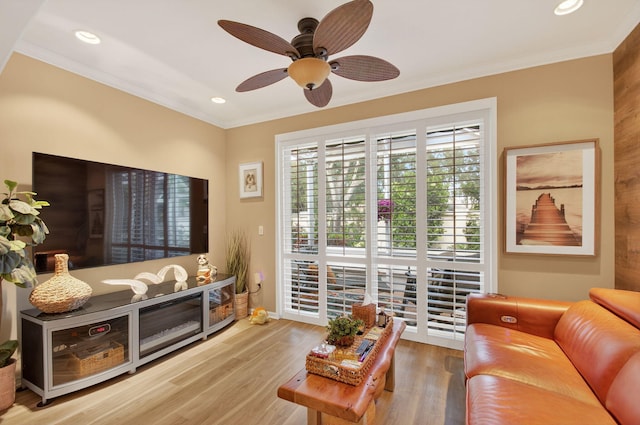 12562 Crystal Pointe Dr Unit B, Boynton Beach, FL 33437 - living area with crown molding, wood finished floors, ceiling fan, recessed lighting, and baseboards