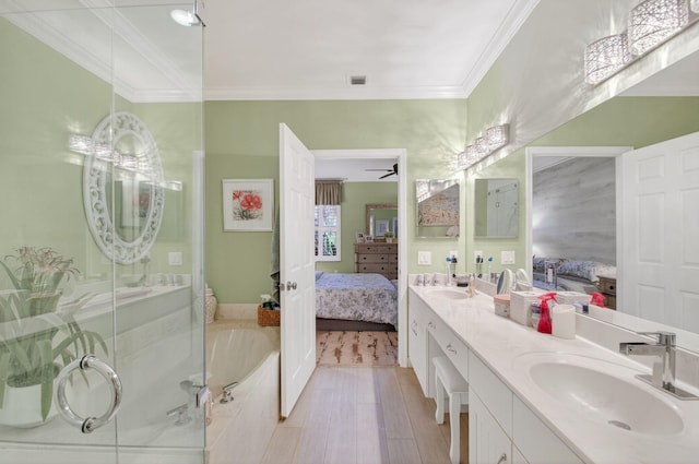 12562 Crystal Pointe Dr Unit B, Boynton Beach, FL 33437 - bathroom with ensuite bathroom, double vanity, a bath, ornamental molding, and wood finished floors