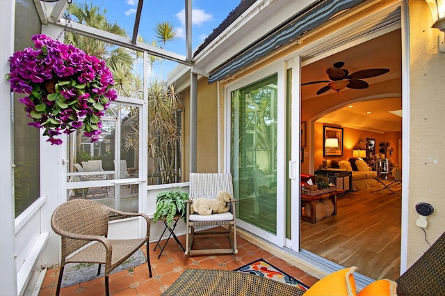 12562 Crystal Pointe Dr Unit B, Boynton Beach, FL 33437 - sunroom / solarium featuring a ceiling fan and arched walkways