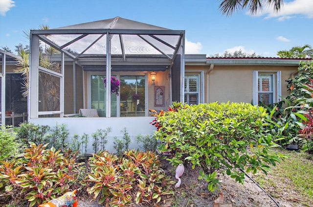 12562 Crystal Pointe Dr Unit B, Boynton Beach, FL 33437 - view of front of property with stucco siding and a lanai