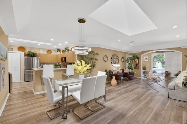 12562 Crystal Pointe Dr Unit B, Boynton Beach, FL 33437 - dining room featuring recessed lighting, light wood finished floors, arched walkways, baseboards, and a chandelier