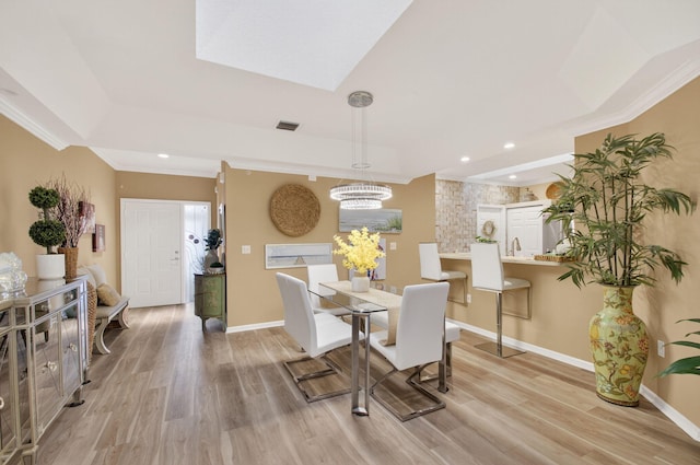 12562 Crystal Pointe Dr Unit B, Boynton Beach, FL 33437 - dining space featuring a chandelier, light wood-type flooring, baseboards, recessed lighting, and ornamental molding