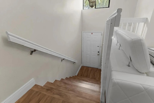 12 Via De Casas Sur Unit 203, Boynton Beach, FL 33426 - stairway with wood finished floors and baseboards