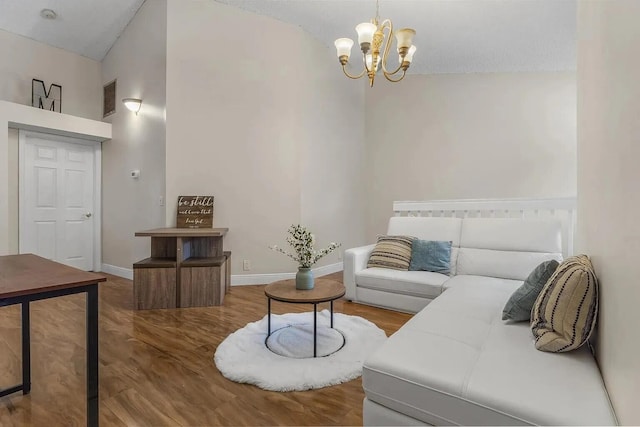 12 Via De Casas Sur Unit 203, Boynton Beach, FL 33426 - living area featuring a chandelier and wood finished floors