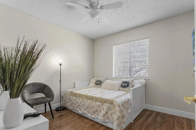 12 Via De Casas Sur Unit 203, Boynton Beach, FL 33426 - bedroom with wood finished floors, a textured ceiling, and a ceiling fan