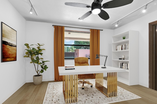 121 W Arch Dr (), Unit Lake Worth, FL 33467 - office featuring rail lighting, light wood finished floors, ceiling fan, and a textured ceiling