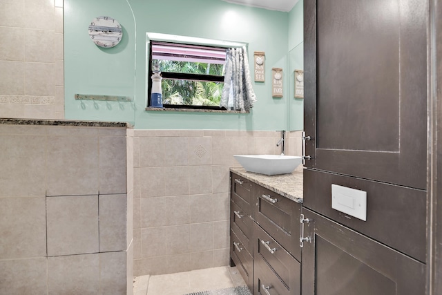 121 W Arch Dr (), Unit Lake Worth, FL 33467 - bathroom with vanity, tile walls, and a wainscoted wall