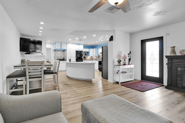 121 W Arch Dr (), Unit Lake Worth, FL 33467 - living room with light wood-style floors, ceiling fan, and recessed lighting