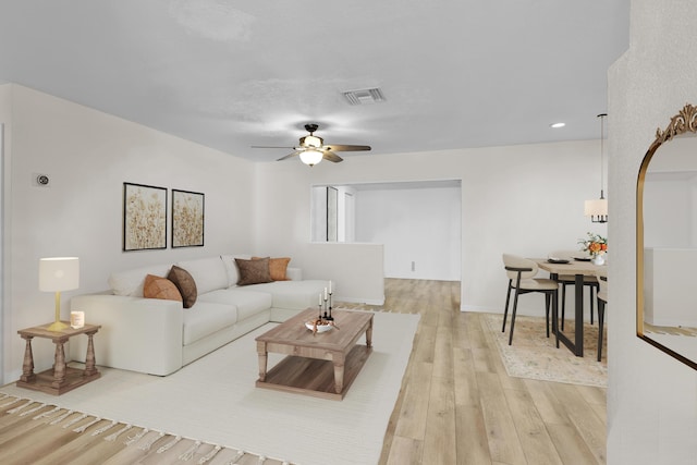 121 W Arch Dr (), Unit Lake Worth, FL 33467 - living room with a ceiling fan, light wood-style flooring, arched walkways, baseboards, and recessed lighting