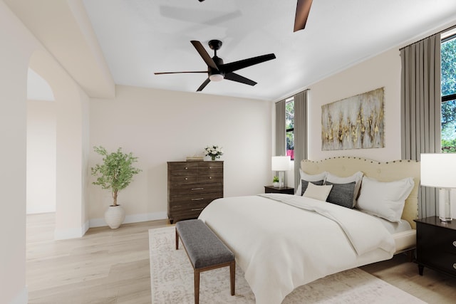 121 W Arch Dr (), Unit Lake Worth, FL 33467 - bedroom with multiple windows, light wood-style flooring, ceiling fan, and baseboards