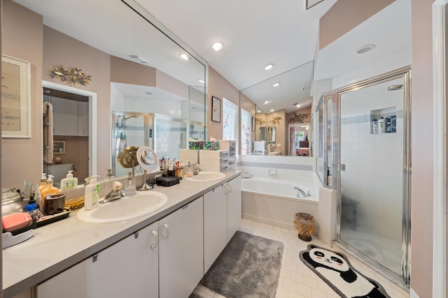 13277 Opal Ln, Wellington, FL 33414 - bathroom featuring a stall shower, double vanity, a bath, and tile patterned flooring