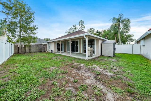 13277 Opal Ln, Wellington, FL 33414 - back of house featuring a fenced backyard, a patio area, and stucco siding