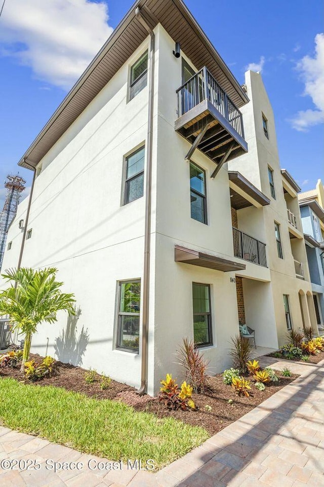840 Florida Ave Unit 5, Cocoa, FL 32922 - view of property exterior with a balcony and stucco siding