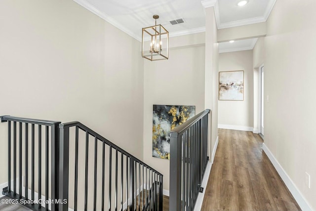 840 Florida Ave Unit 5, Cocoa, FL 32922 - staircase with crown molding, a chandelier, wood finished floors, and baseboards