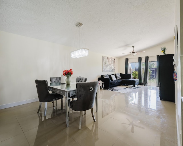 5402 Bonky Ct Unit 102B, West Palm Beach, FL 33415 - dining area featuring a textured ceiling, light tile patterned floors, a ceiling fan, and baseboards