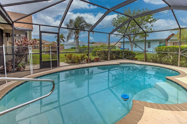 3892 SW Jablo St, Port Saint Lucie, FL 34953 - swimming pool with a lanai, a patio area, and a residential view