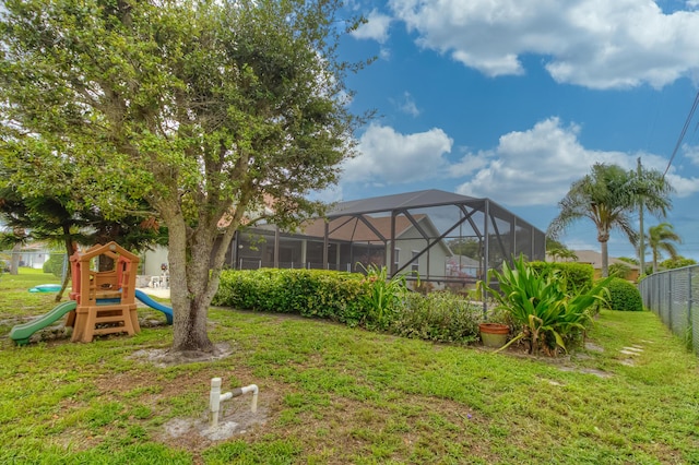 3892 SW Jablo St, Port Saint Lucie, FL 34953 - view of yard featuring a playground and a lanai